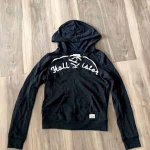 navy blue Hollister hoodie with tied up v-neck